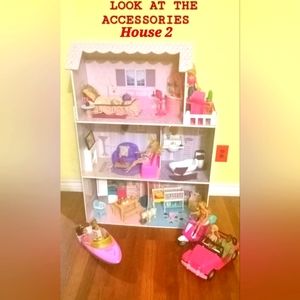 Doll House With 7 barbies, 2 babies, 1 Ken, 1 puppy, 1 boat, 1 jeep, 1 jeep.
